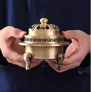 Three-legged bronze incense burner with ruyi motifs