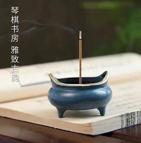 Small three-legged copper incense burner with a blue-glazed finish