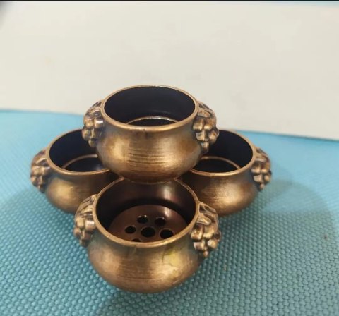 Small antique bronze lion-eared incense burner with seven holes, metal incense holder