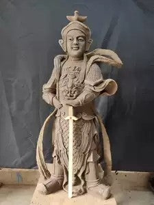 Colourfully painted clay sculpture of Vaisravana