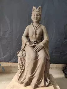 Colour-painted clay sculpture of the Fox Fairy